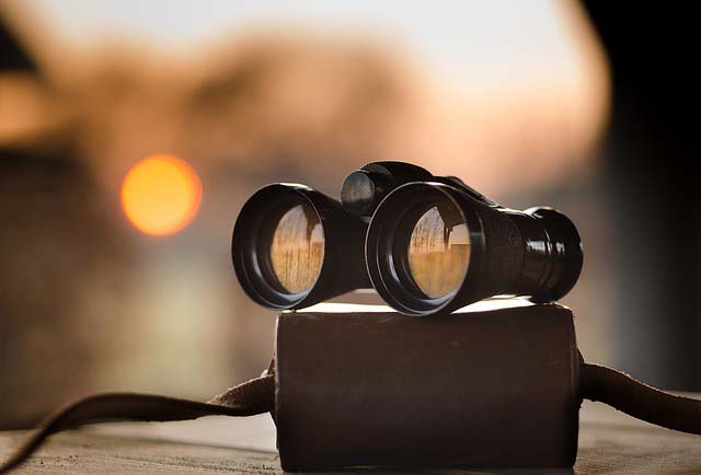 Binoculars filter the sunset
